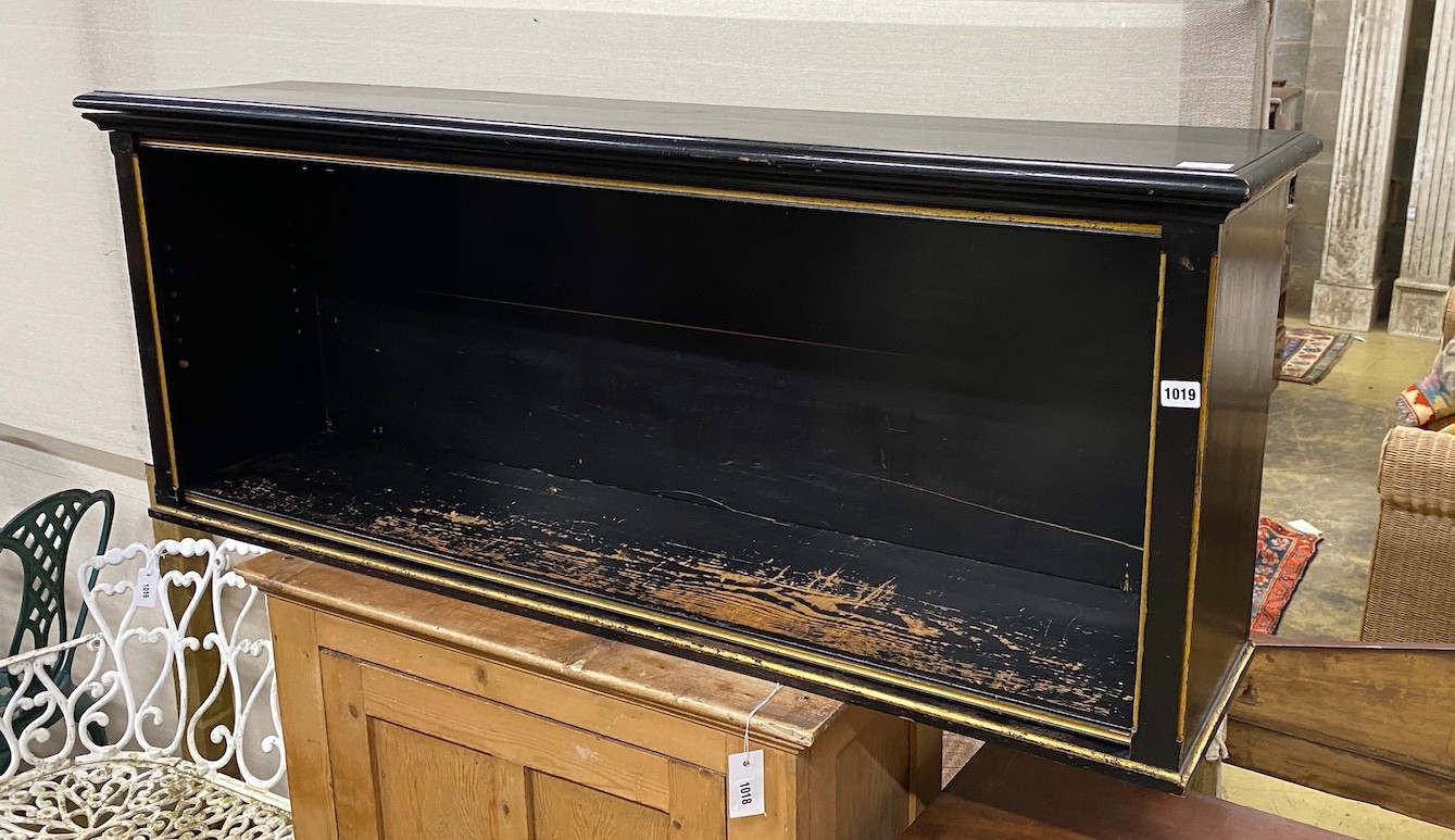 A Victorian ebonized parcel gilt open book shelf, width 142cm, depth 33cm, height 56cm.